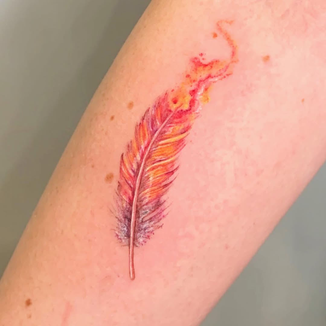 Vibrant feather tattoo with artistic flair Tattoo Design