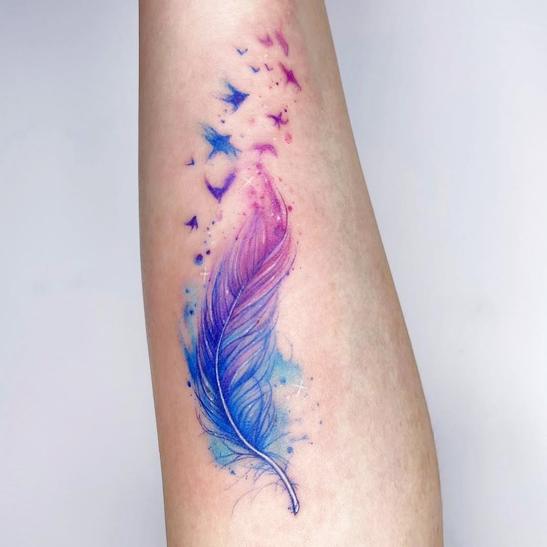 Vibrant feather tattoo with flowing watercolor design Tattoo Design