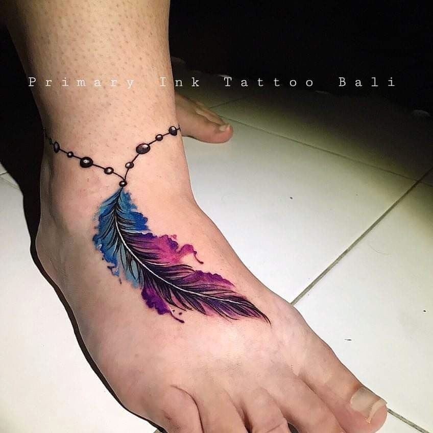 Vibrant Feather Tattoo with Intricate Details Tattoo Design