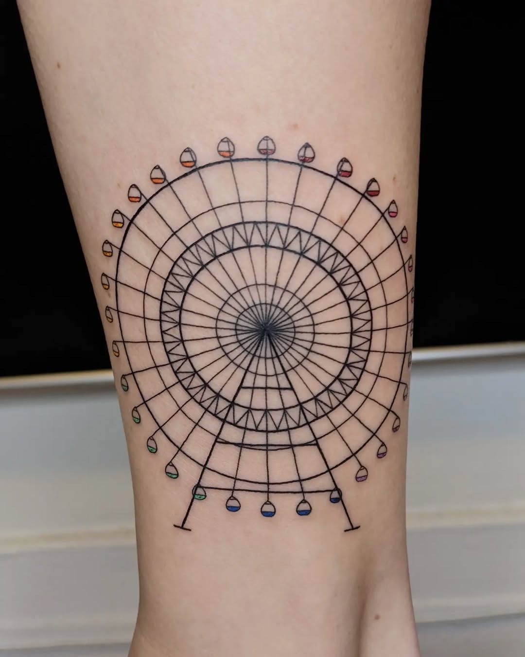 Minimalist Ferris Wheel Tattoo with Colorful Lights Tattoo Design
