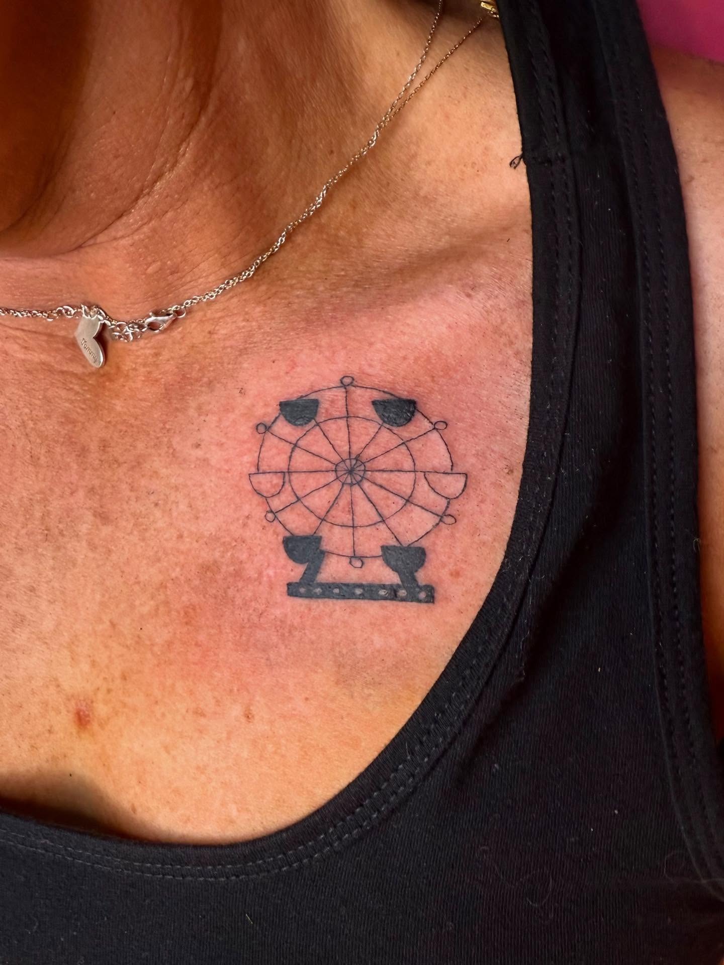 Minimalistic ferris wheel tattoo on collarbone Tattoo Design
