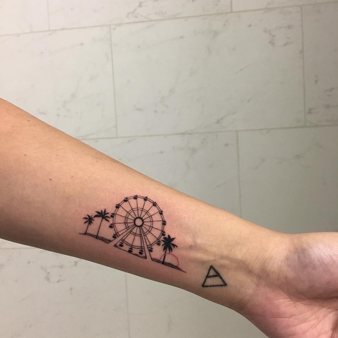 Sleek Ferris wheel tattoo with palm trees Tattoo Design