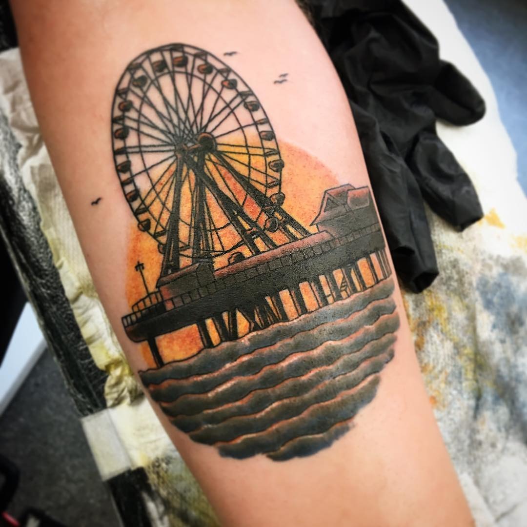 Stunning Ferris Wheel Tattoo by the Sea Tattoo Design
