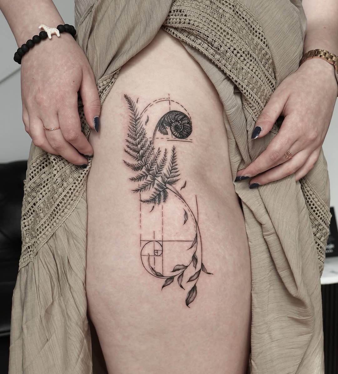 Nature-inspired Fibonacci fern tattoo on thigh Tattoo Design