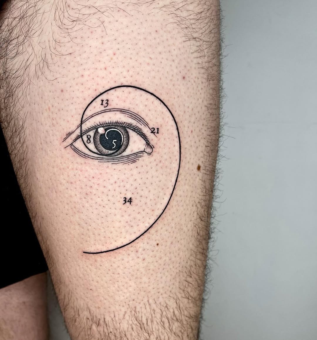 Stylish Fibonacci spiral with an eye design Tattoo Design