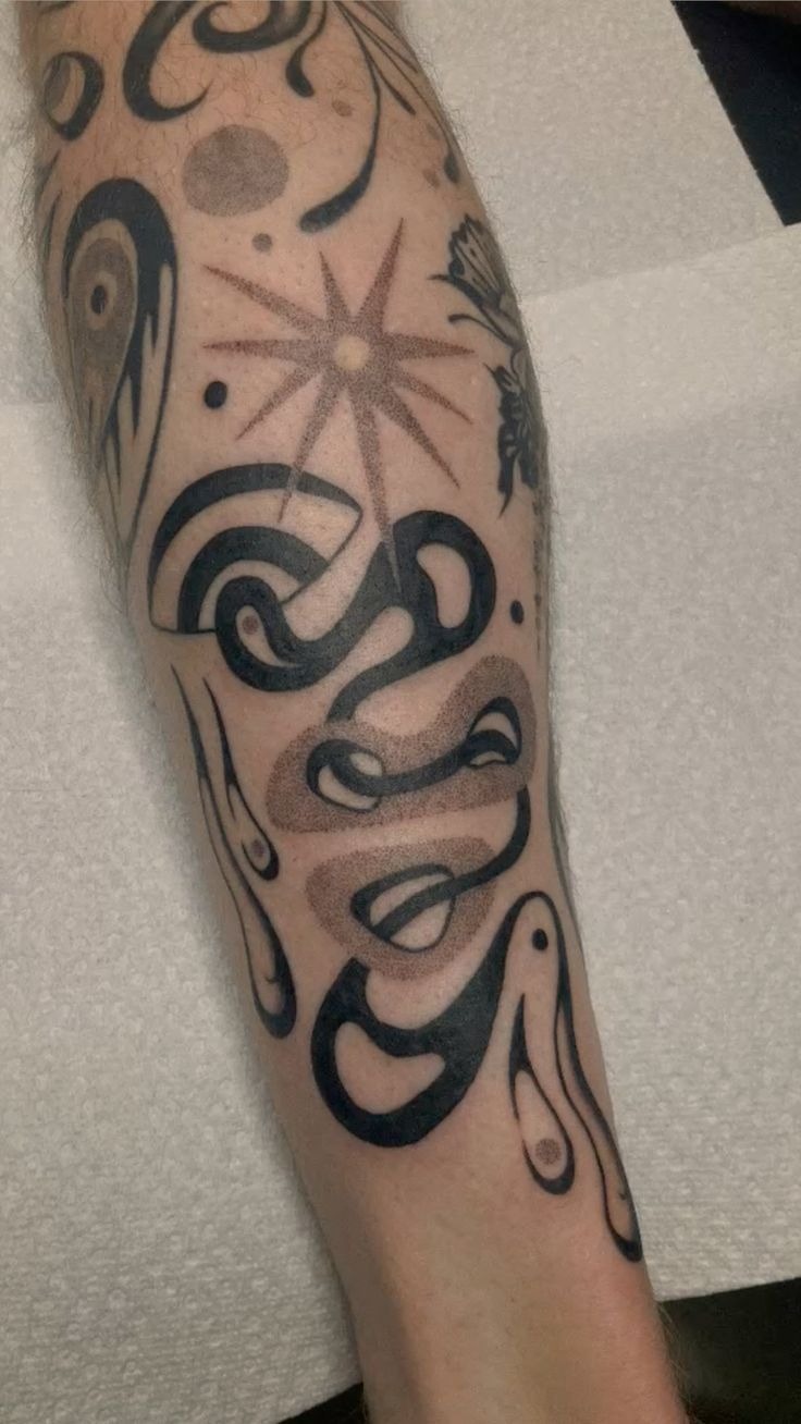 Abstract Curves for an Artful Blackwork Sleeve, a tattoo design rendered in clean detailed linework for the rib.