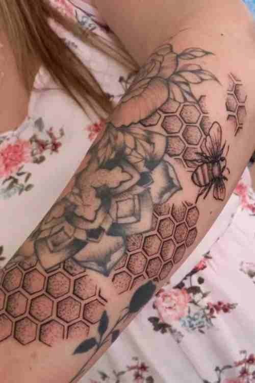 Bees, Flowers, and Honeycomb for a Nature-Themed Sleeve, a tattoo design rendered in delicate fine-line for the back.