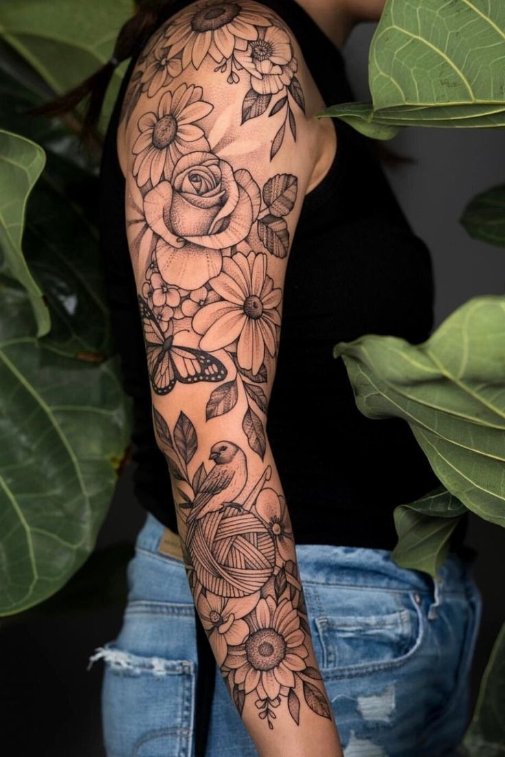 Botanical Gaps Filled with Leaves and Smaller Blooms, a tattoo design rendered in clean detailed linework for the forearm.