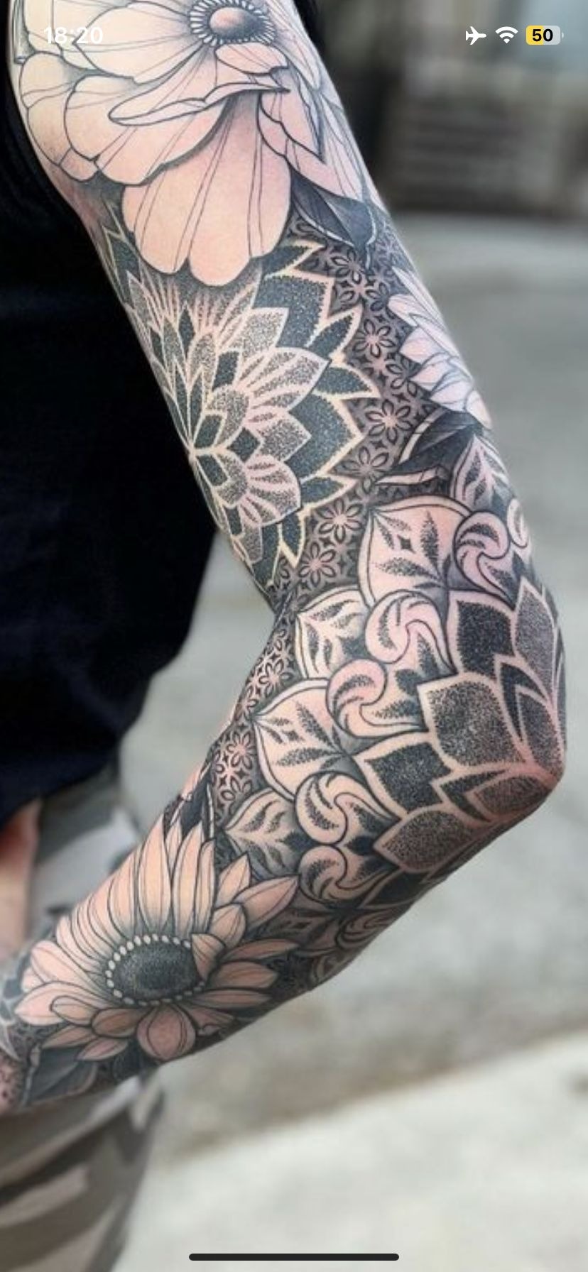 Dense Floral Patterns for a Nearly Seamless Sleeve, a tattoo design rendered in clean detailed linework.