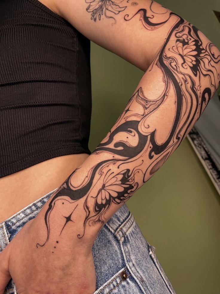 Flowing Black Shapes as Modern Organic Filler, a tattoo design rendered in clean detailed linework for the wrist.