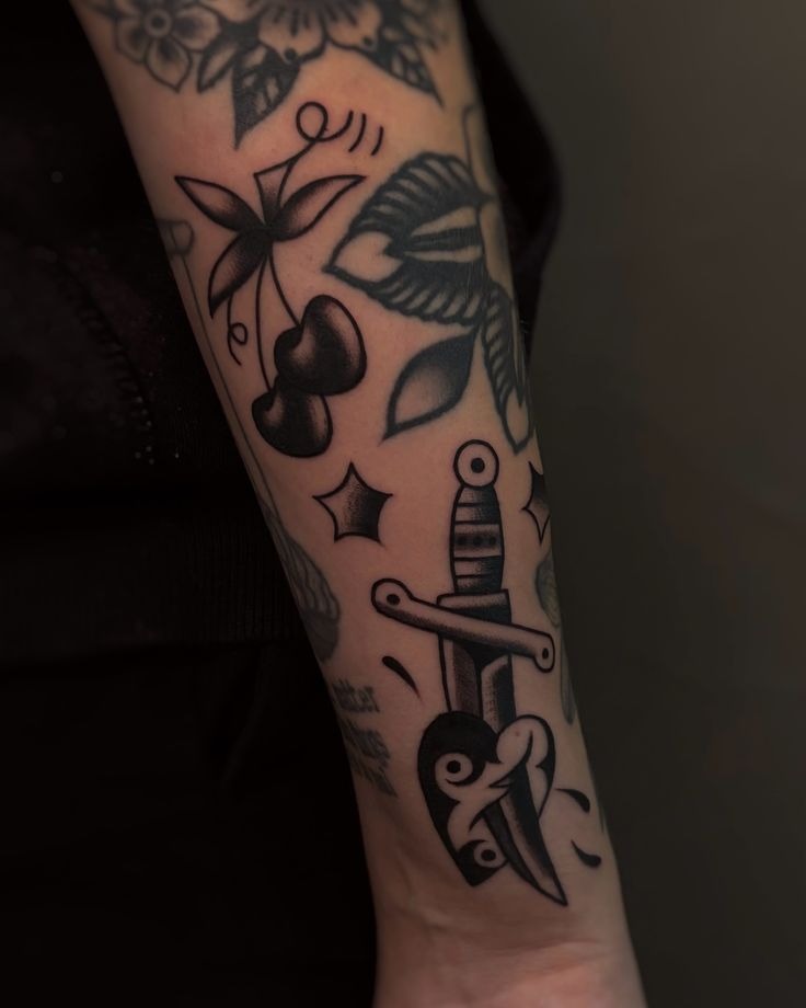 Small Traditional Dagger and Sparkle Gap Fillers, a tattoo design rendered in bold traditional for the sleeve.
