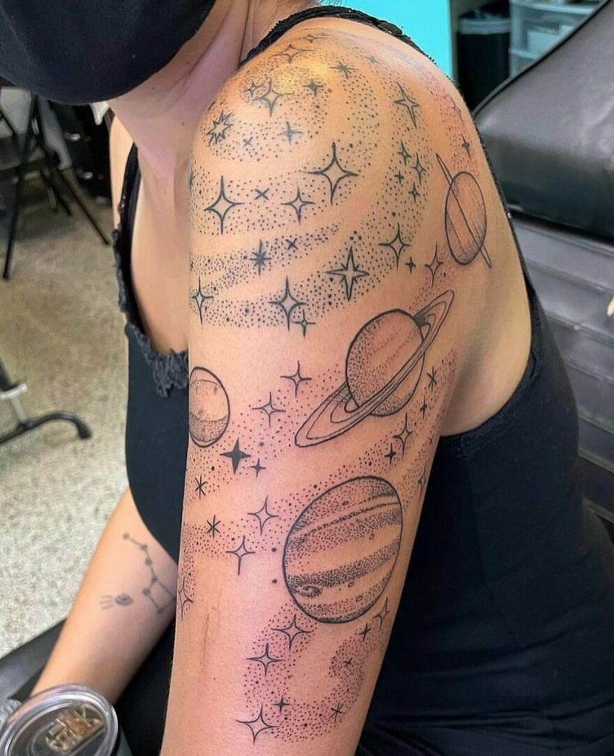 Starry Dotwork Around a Planetary Sleeve, a tattoo design rendered in delicate fine-line for the back.