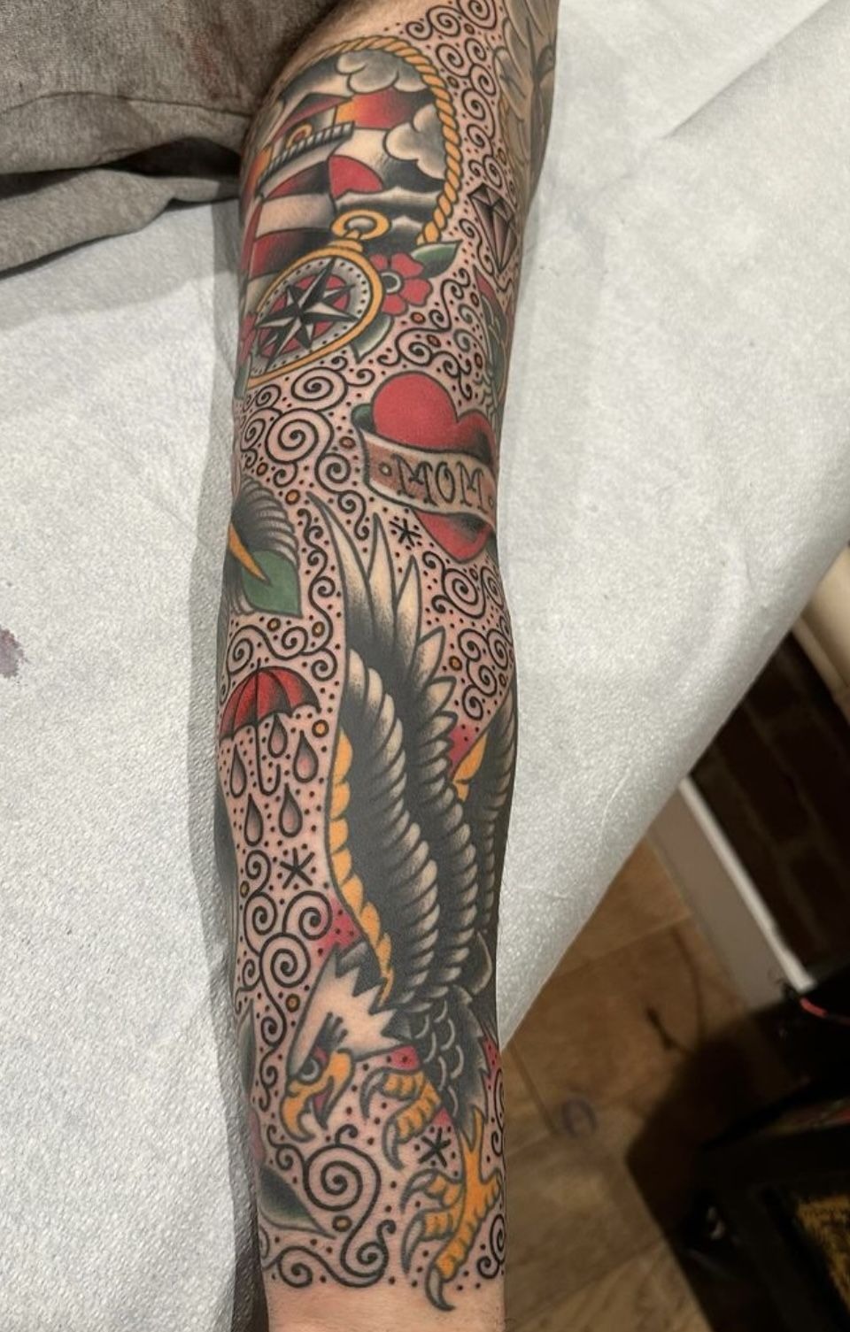 Swirls and Dotwork Between Bold Old-School Motifs, a tattoo design rendered in bold traditional for the sleeve.