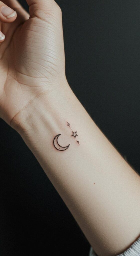 Fine line crescent moon with a tiny star tattoo on the inner wrist