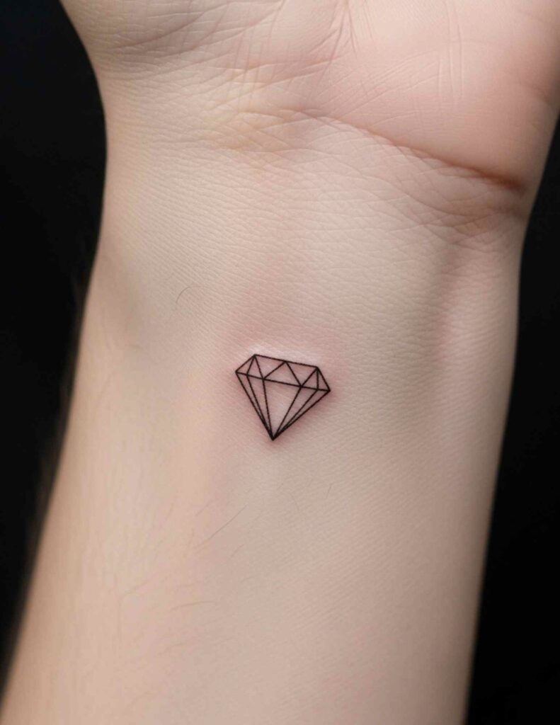 Small diamond outline tattoo on the inner wrist