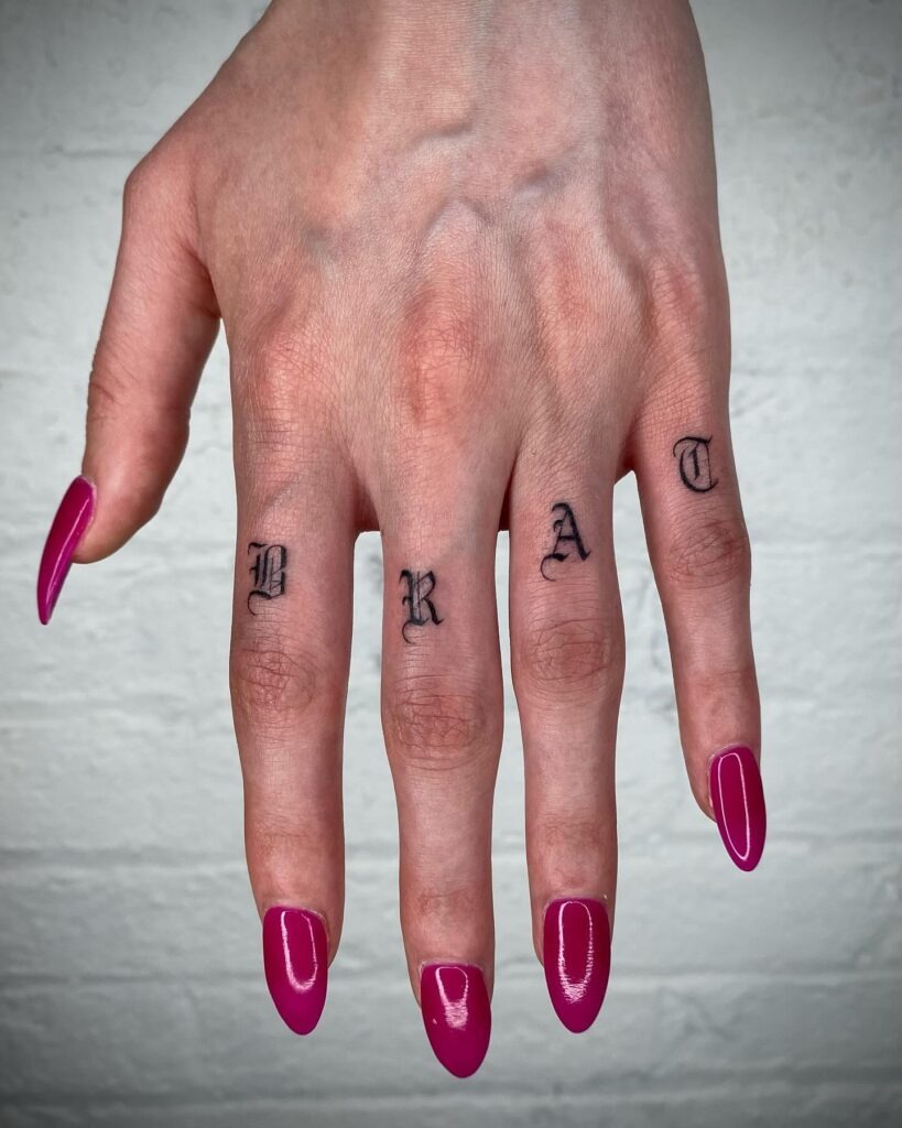 Minimalist Upside-Down Cross Finger Tattoo Tattoo Design