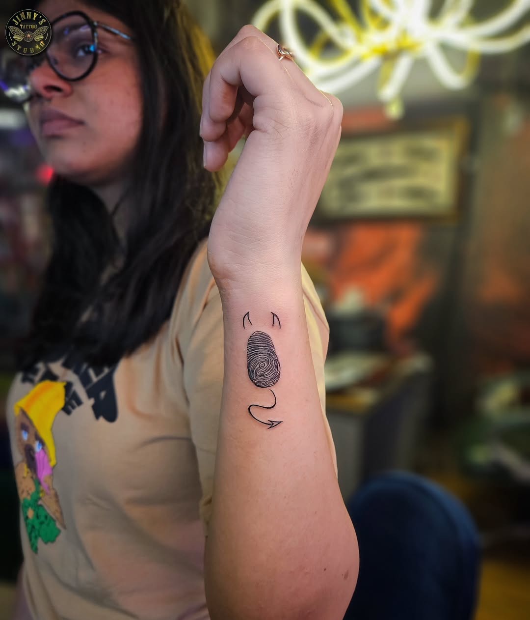 Artistic Fingerprint Tattoo Design on Arm Tattoo Design