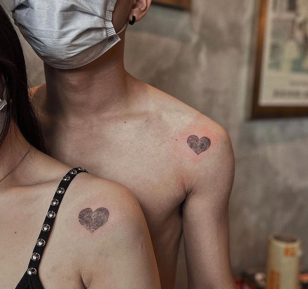 Stylish fingerprint heart tattoos on display Tattoo Design