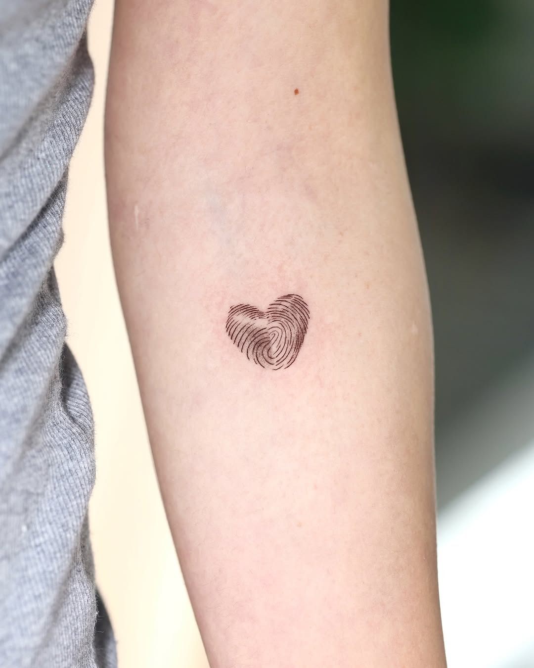 Stylish heart-shaped fingerprint tattoo on arm Tattoo Design