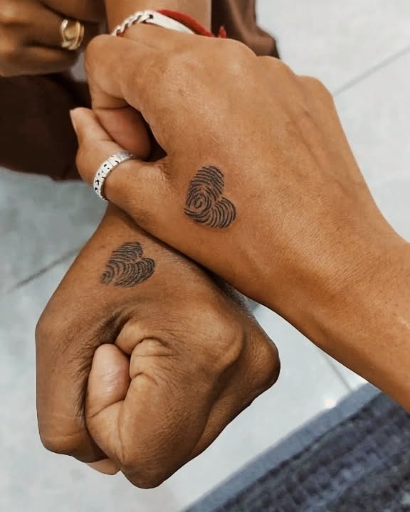Unique fingerprint heart tattoos on hands Tattoo Design