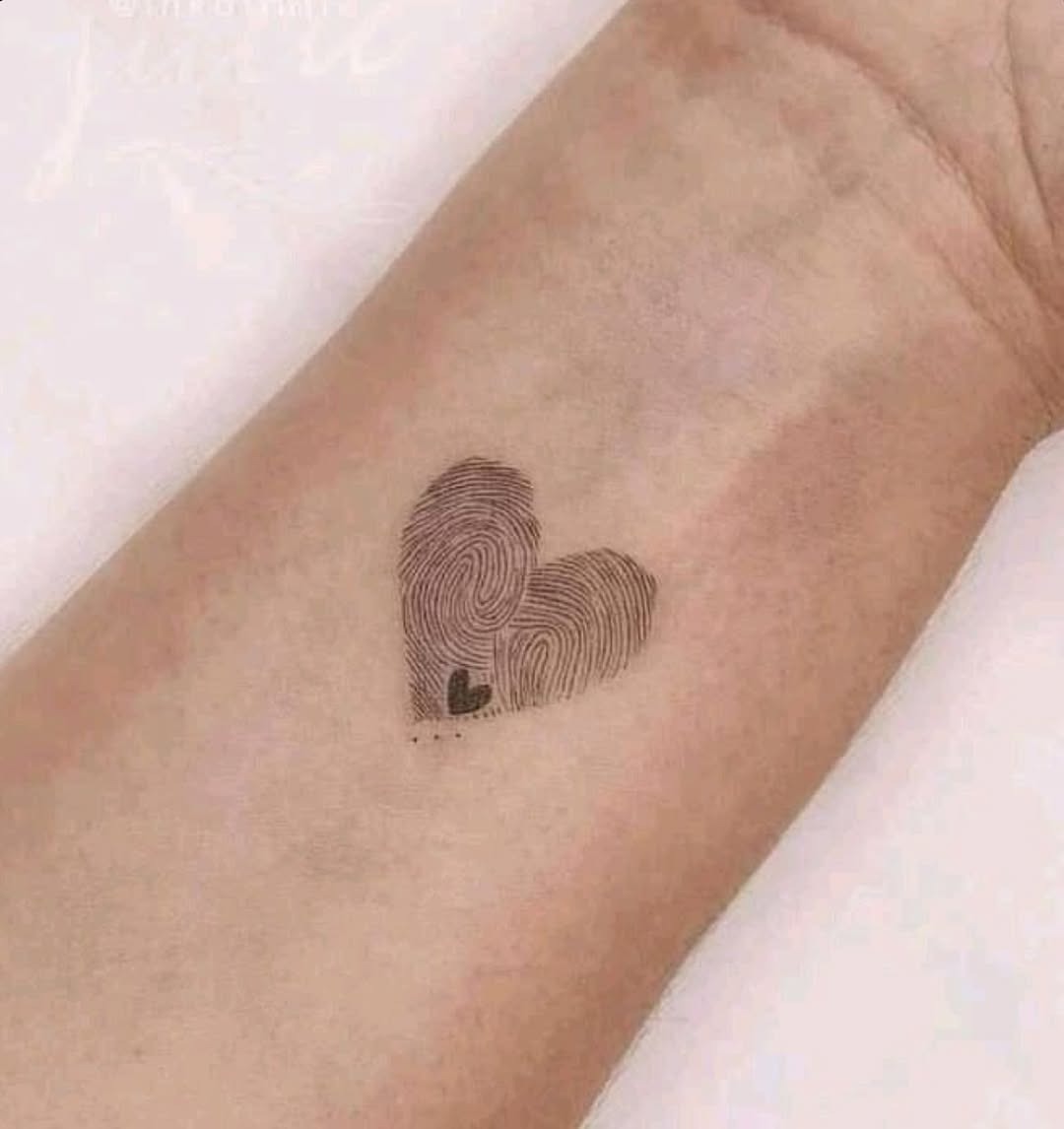 Unique heart-shaped fingerprint tattoo design Tattoo Design