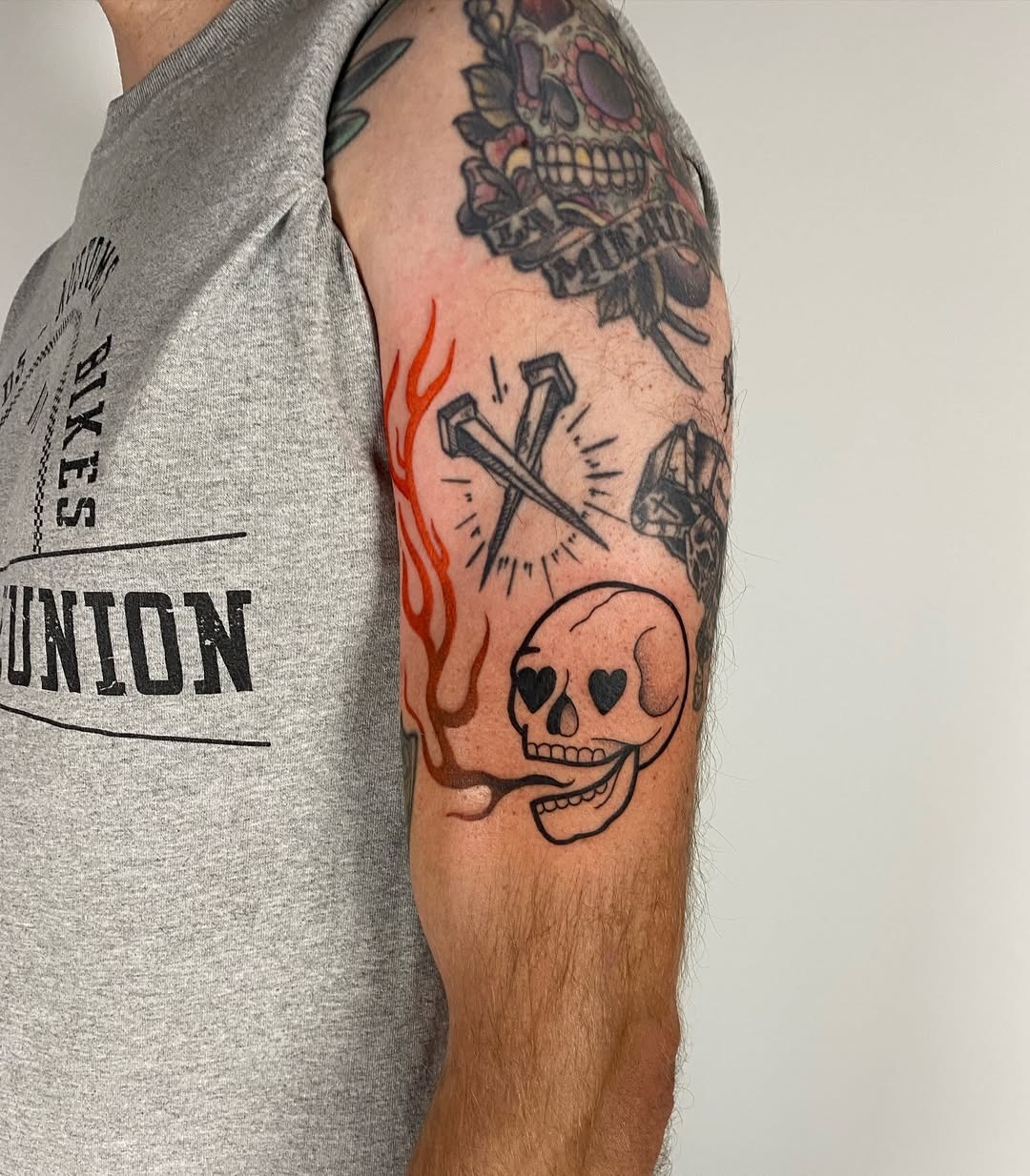A striking skull tattoo amidst fiery flames Tattoo Design