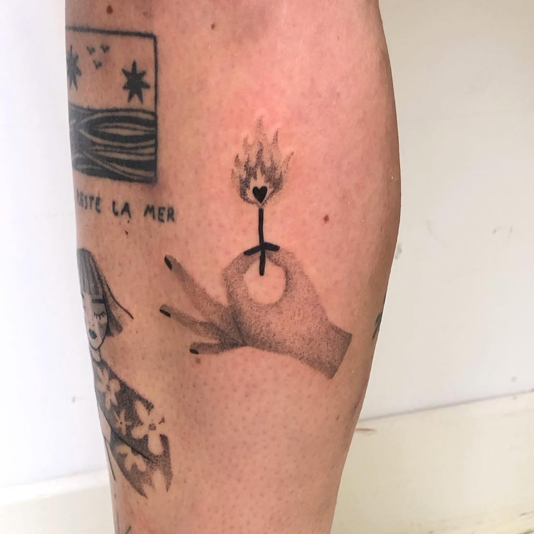 A striking tattoo depicting a fiery heart Tattoo Design
