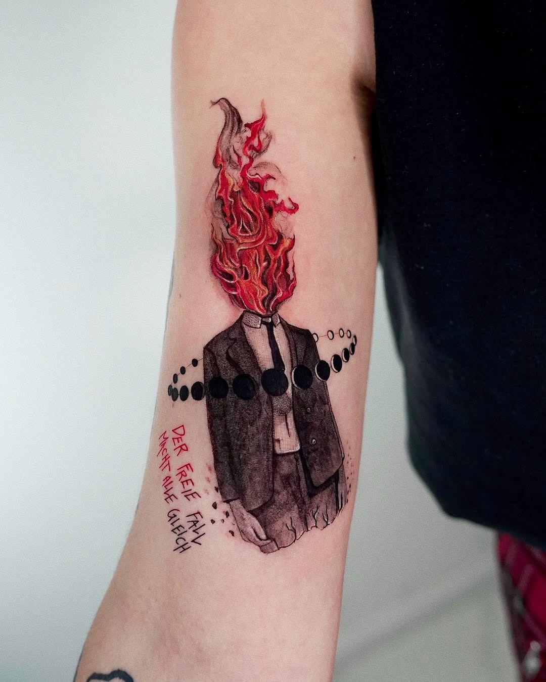 Creative fire-themed tattoo with striking colors Tattoo Design