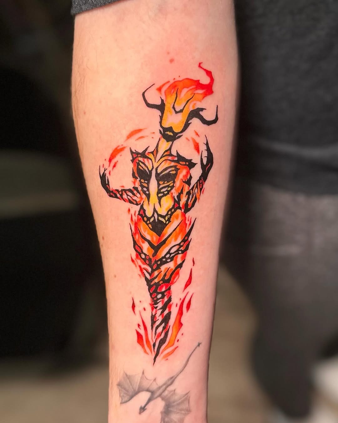 Dynamic fire-themed tattoo showcasing bold colors Tattoo Design