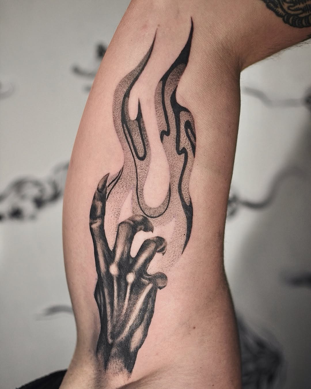 Intricate fire tattoo with skeletal hand design Tattoo Design