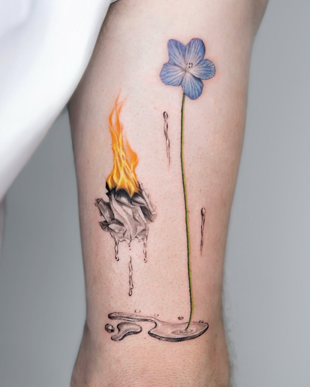 Intricate fusion of fire and floral tattoos Tattoo Design