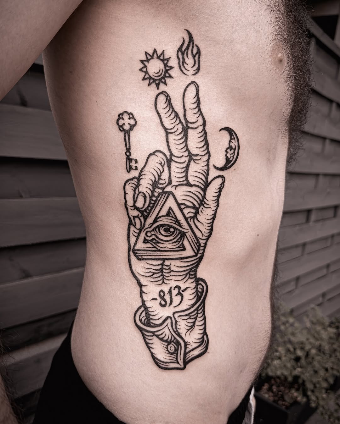 Intricate hand tattoo with celestial symbols Tattoo Design