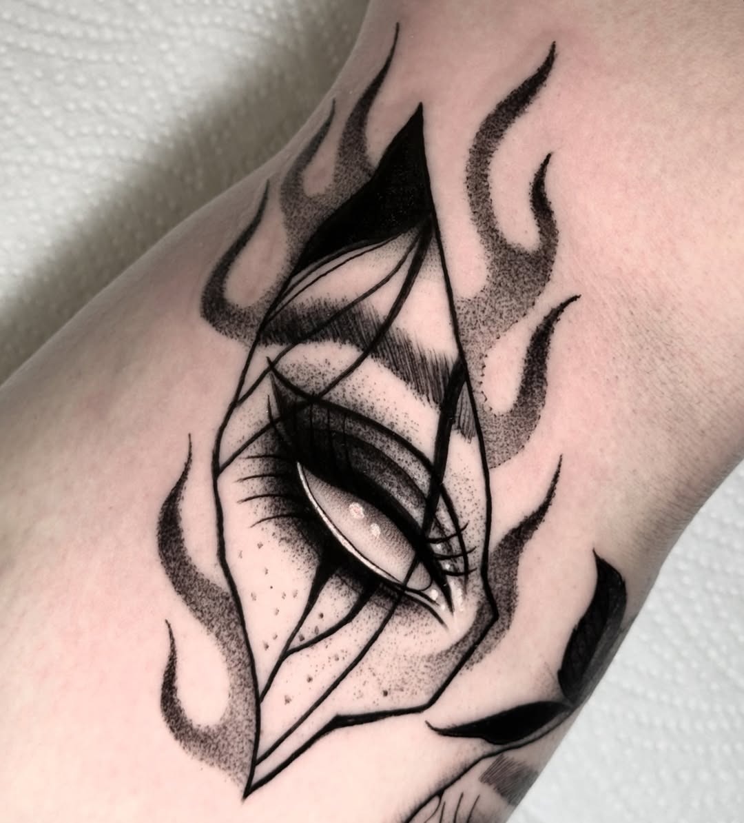 Sleek eye art enveloped by flames Tattoo Design