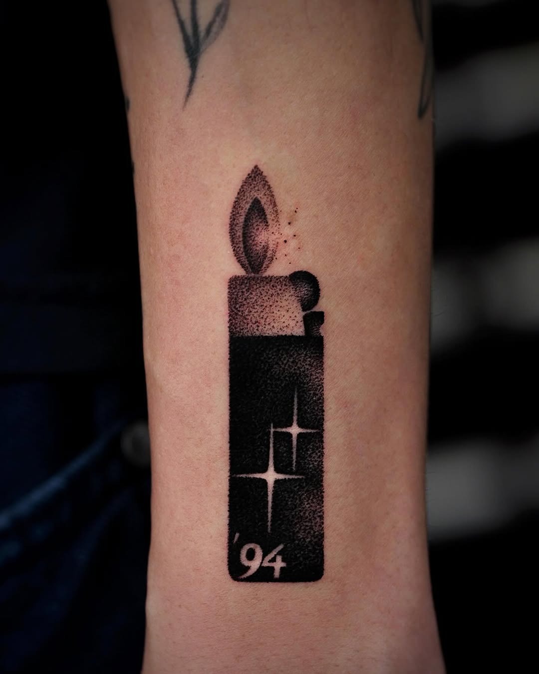 Sleek lighter tattoo with flame design Tattoo Design