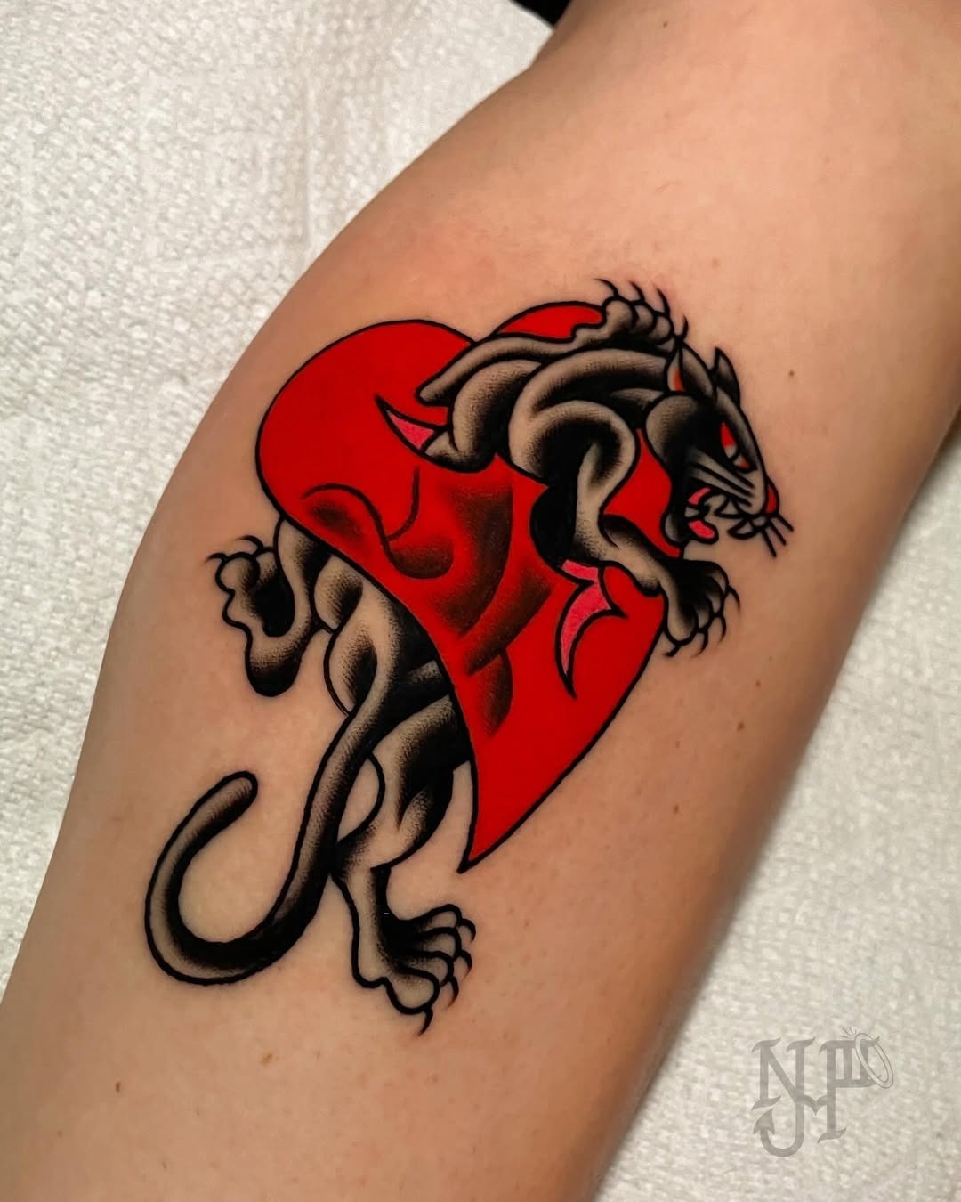 Striking fire panther tattoo on skin Tattoo Design