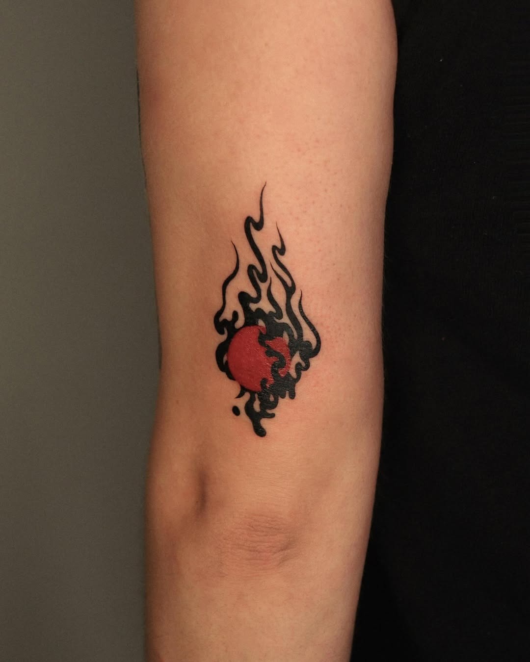 Stunning Red Circle Surrounded by Fiery Flames Tattoo Design