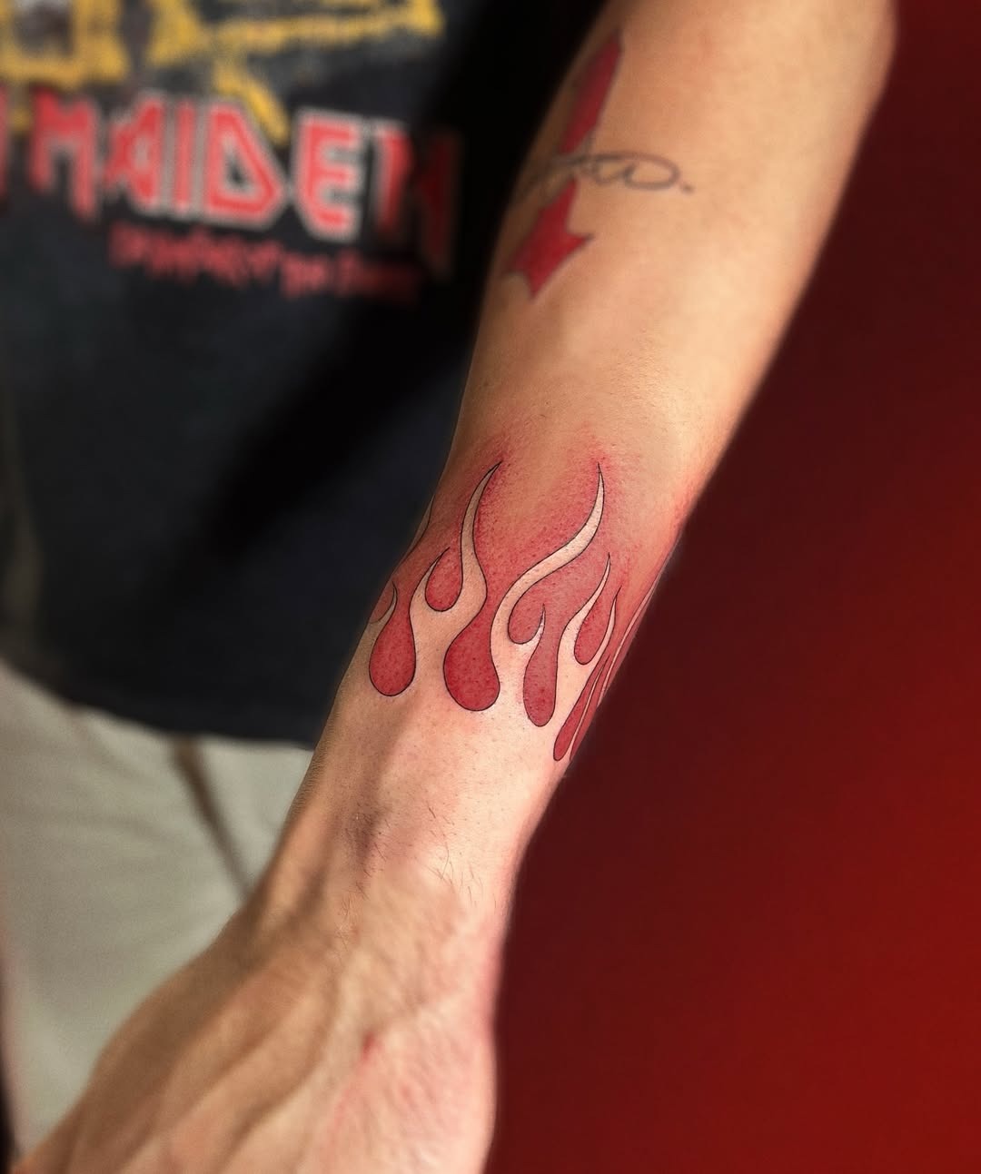 Stylish red flames tattoo on the arm Tattoo Design