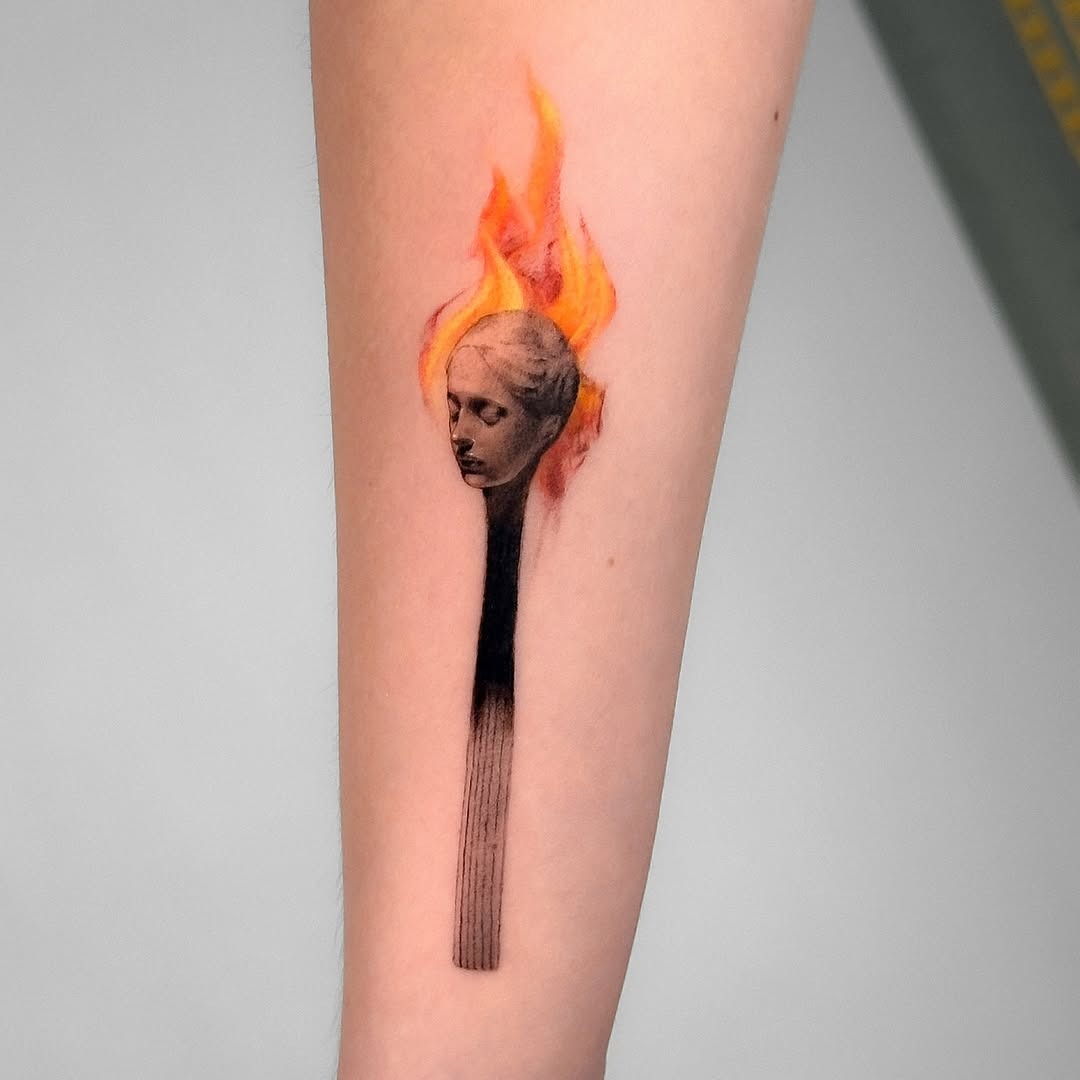 Unique Matchstick Fire Tattoo Featuring Human Face Tattoo Design