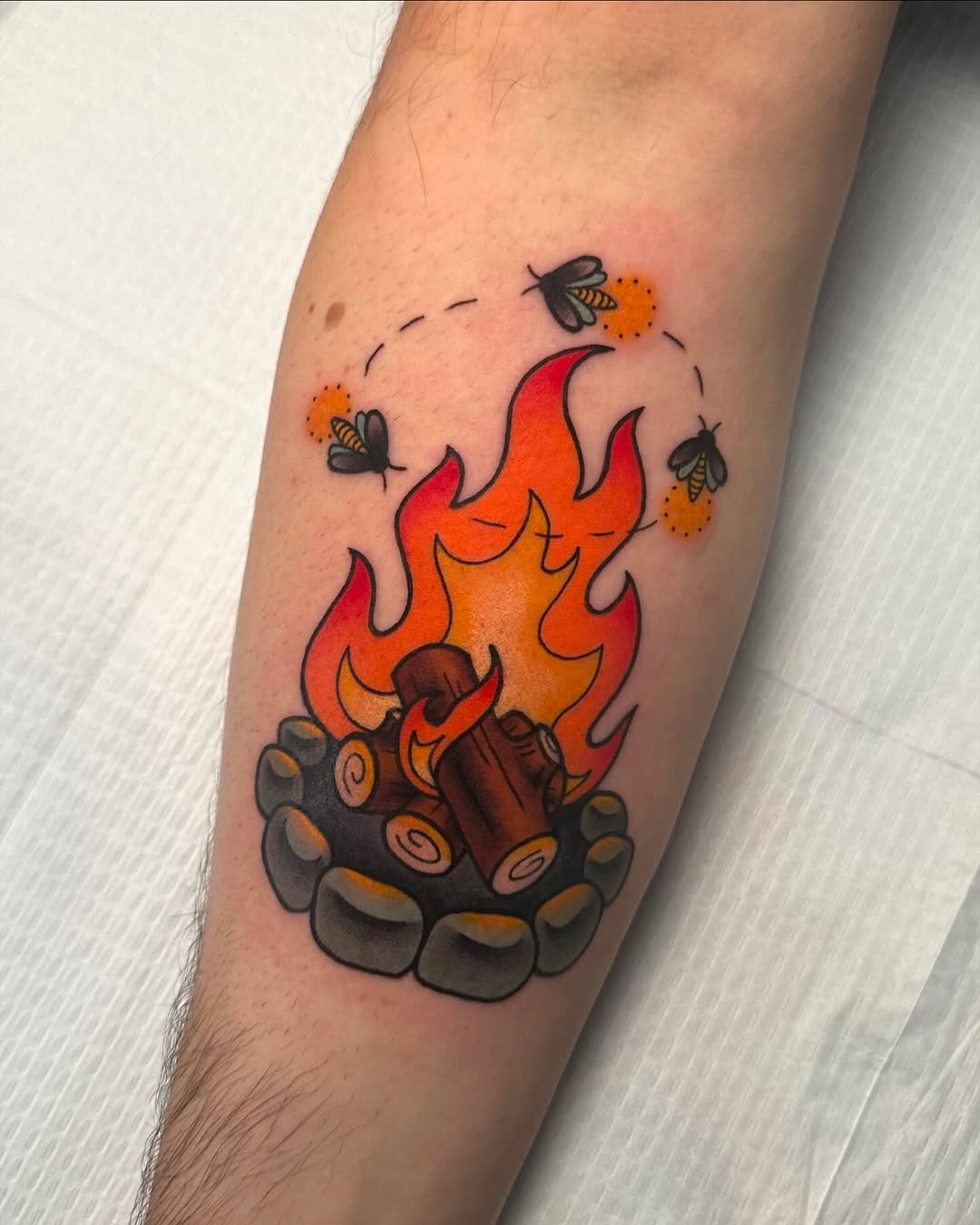 Vibrant Campfire Tattoo with Playful Details Tattoo Design