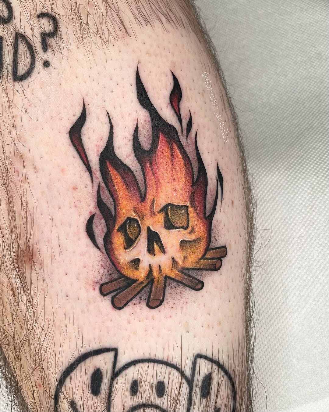 Vibrant fire skull tattoo on an arm Tattoo Design