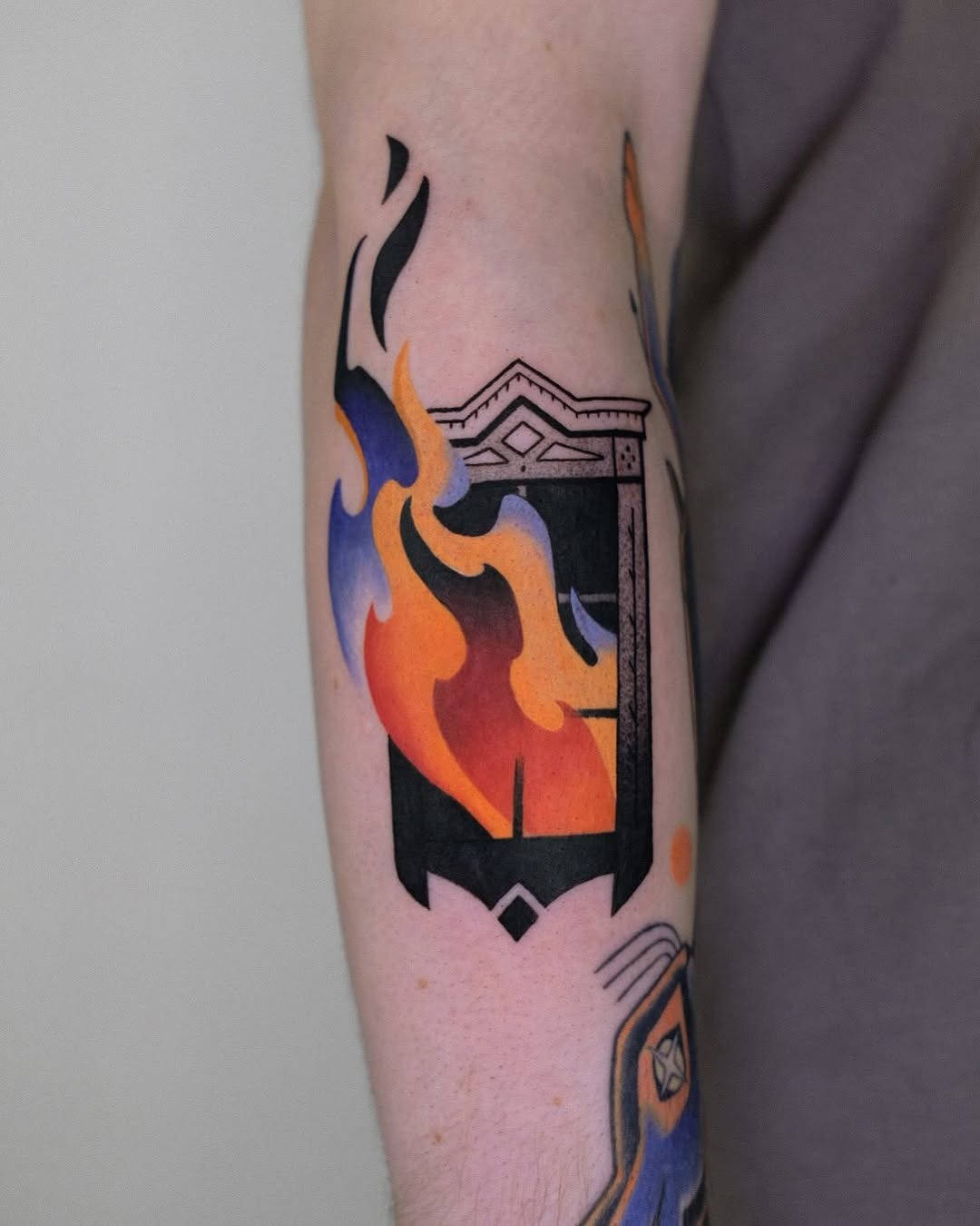 Vibrant flames framing an artistic design Tattoo Design