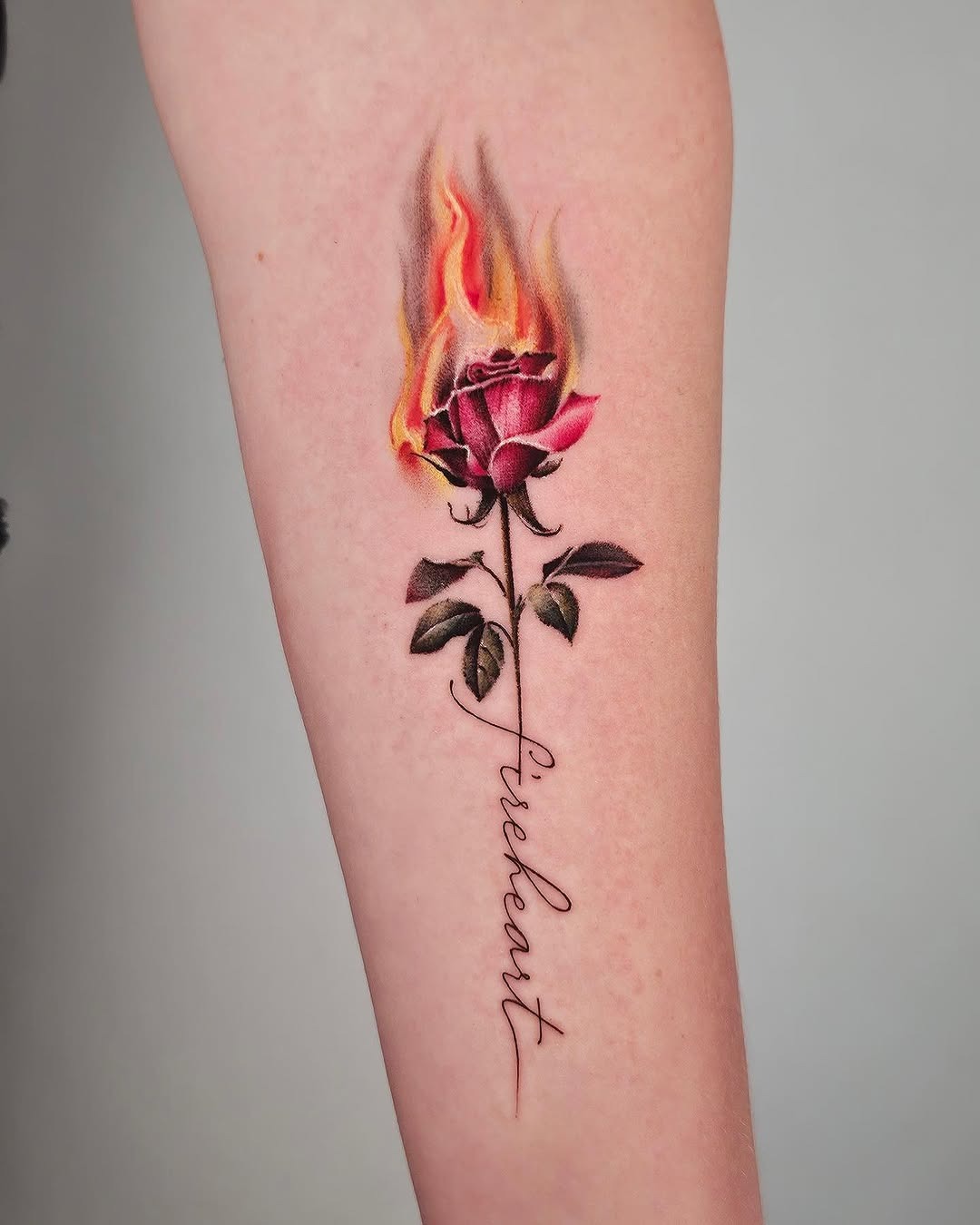 Vibrant rose tattoo engulfed in flames Tattoo Design