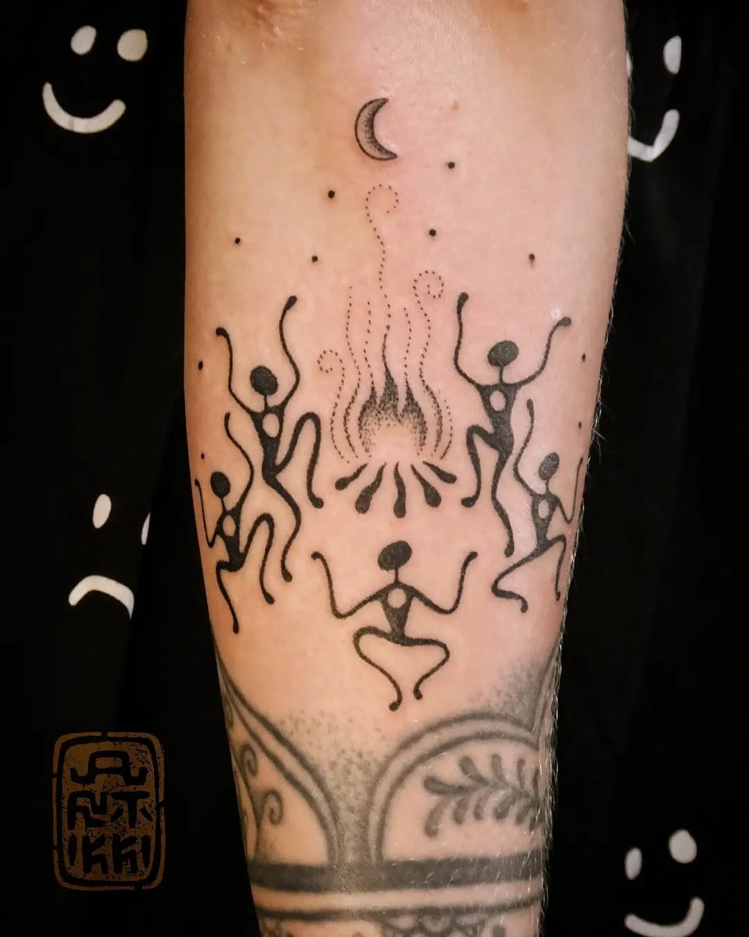 Whimsical dancing figures around a fire Tattoo Design
