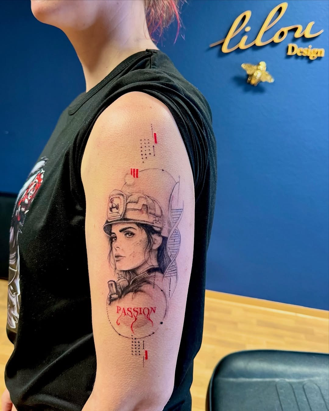 This striking tattoo features a detailed portrait of a female firefighter, highlighting her determination and pride.