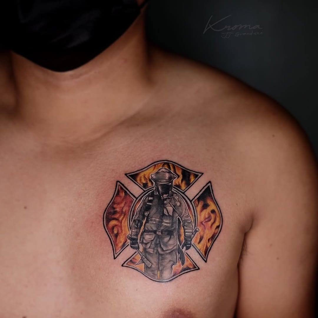 This tattoo features a striking image of a firefighter surrounded by flames, symbolizing courage and dedication.