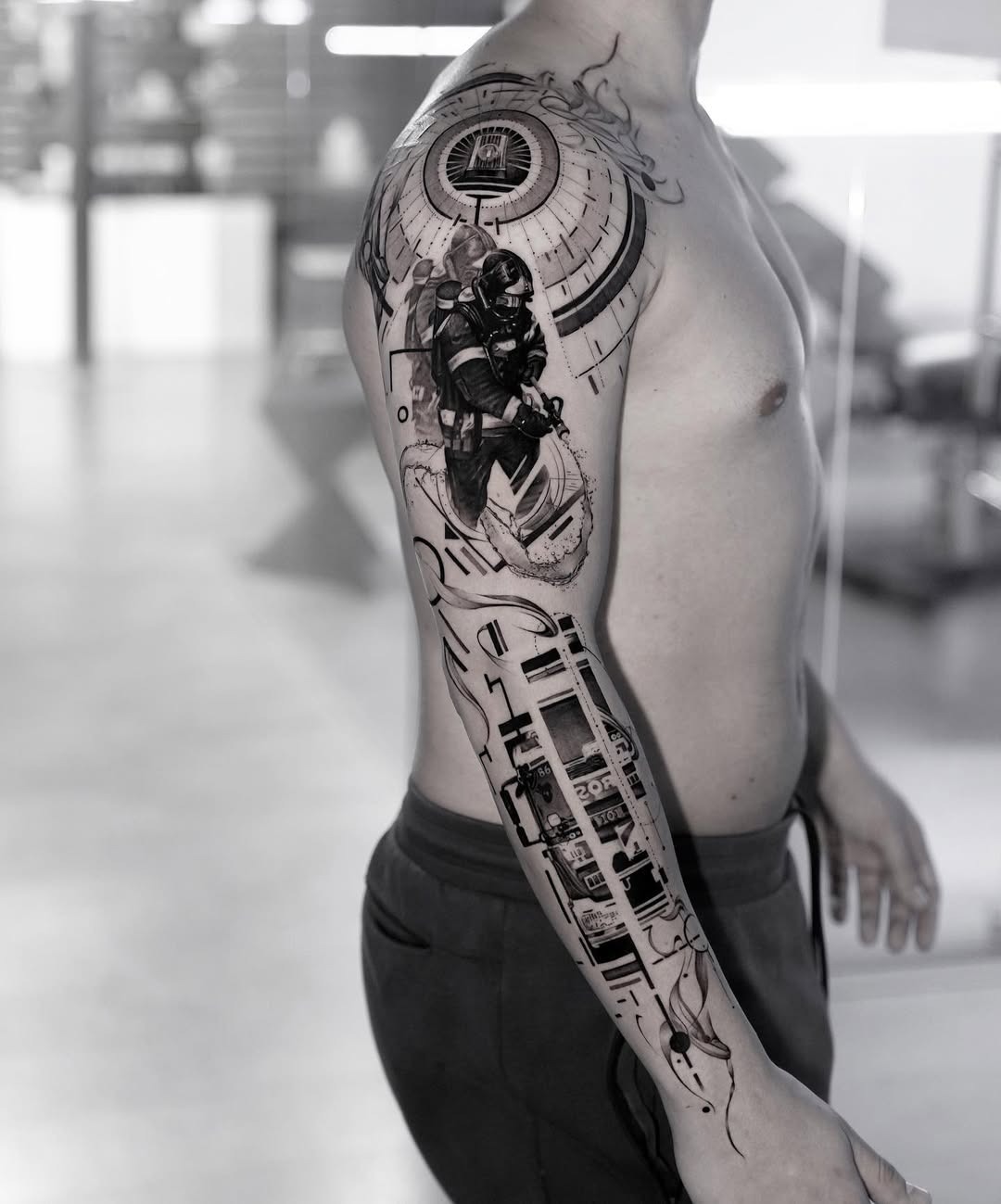 This intricate tattoo showcases a firefighter in action, capturing the essence of bravery and heroism.