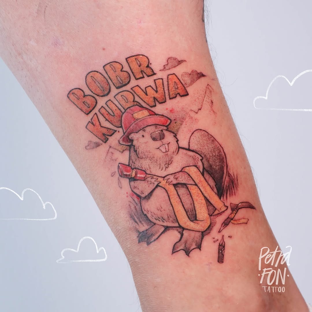 This tattoo showcases a humorous portrayal of a critter, donning a firefighter's hat and holding equipment.