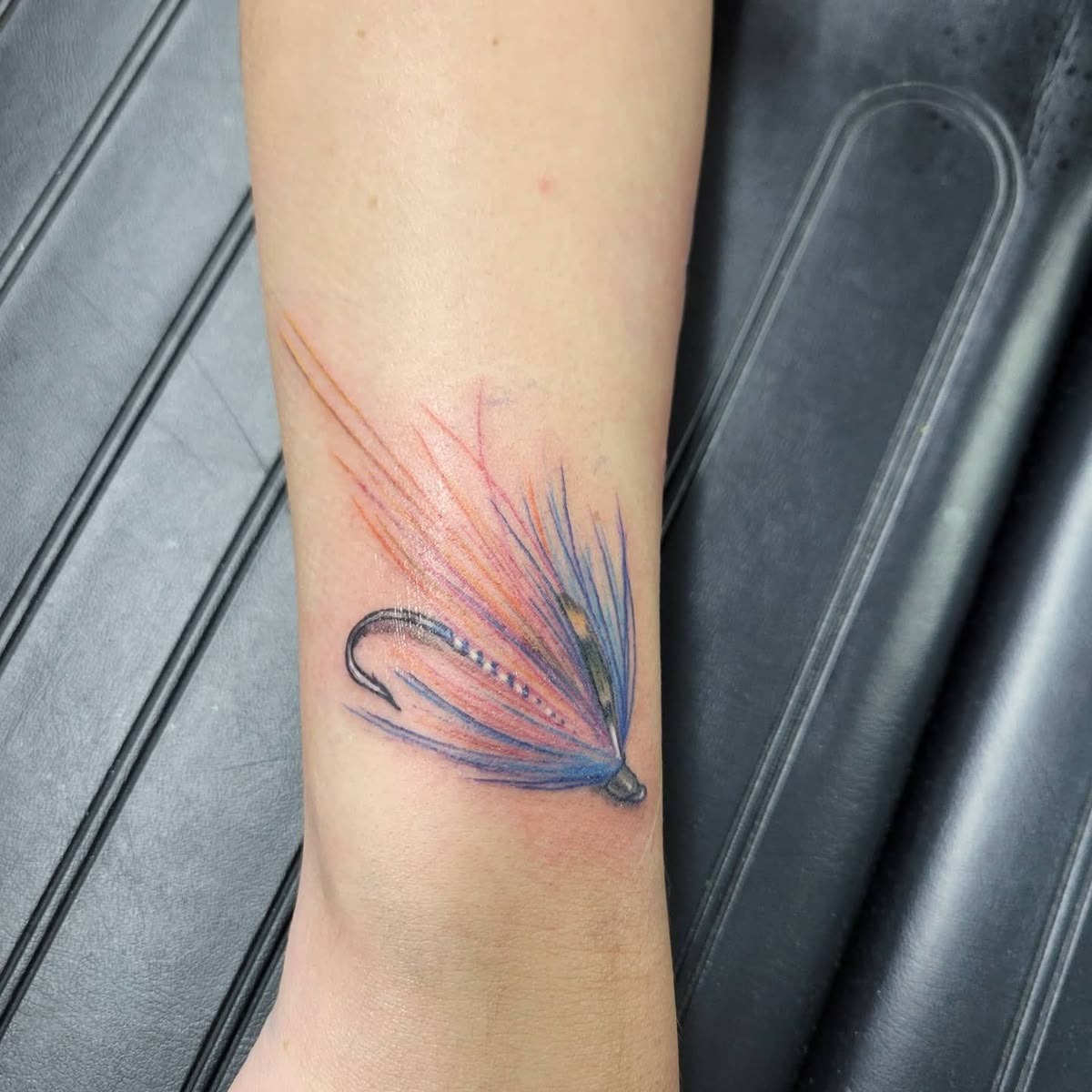 Colorful Fly Fishing Tattoo, a tattoo design rendered in clean detailed linework.
