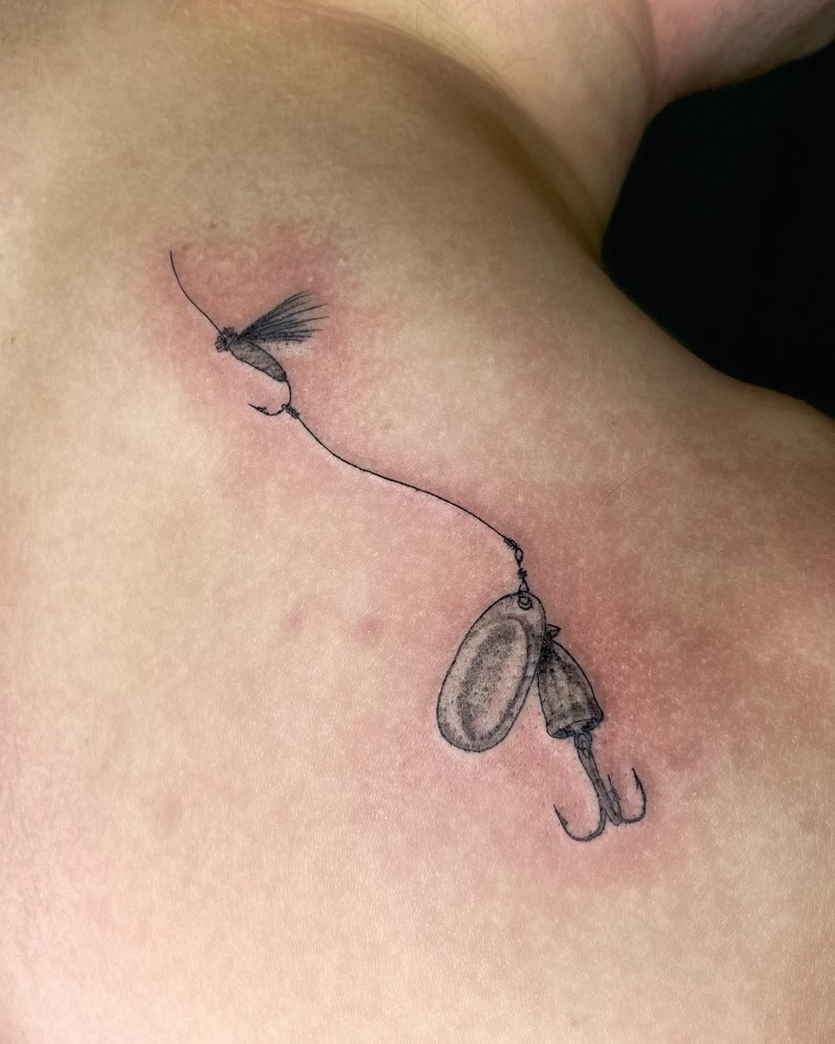 Fine Line Spinner and Fly Design, a tattoo design rendered in delicate fine-line.