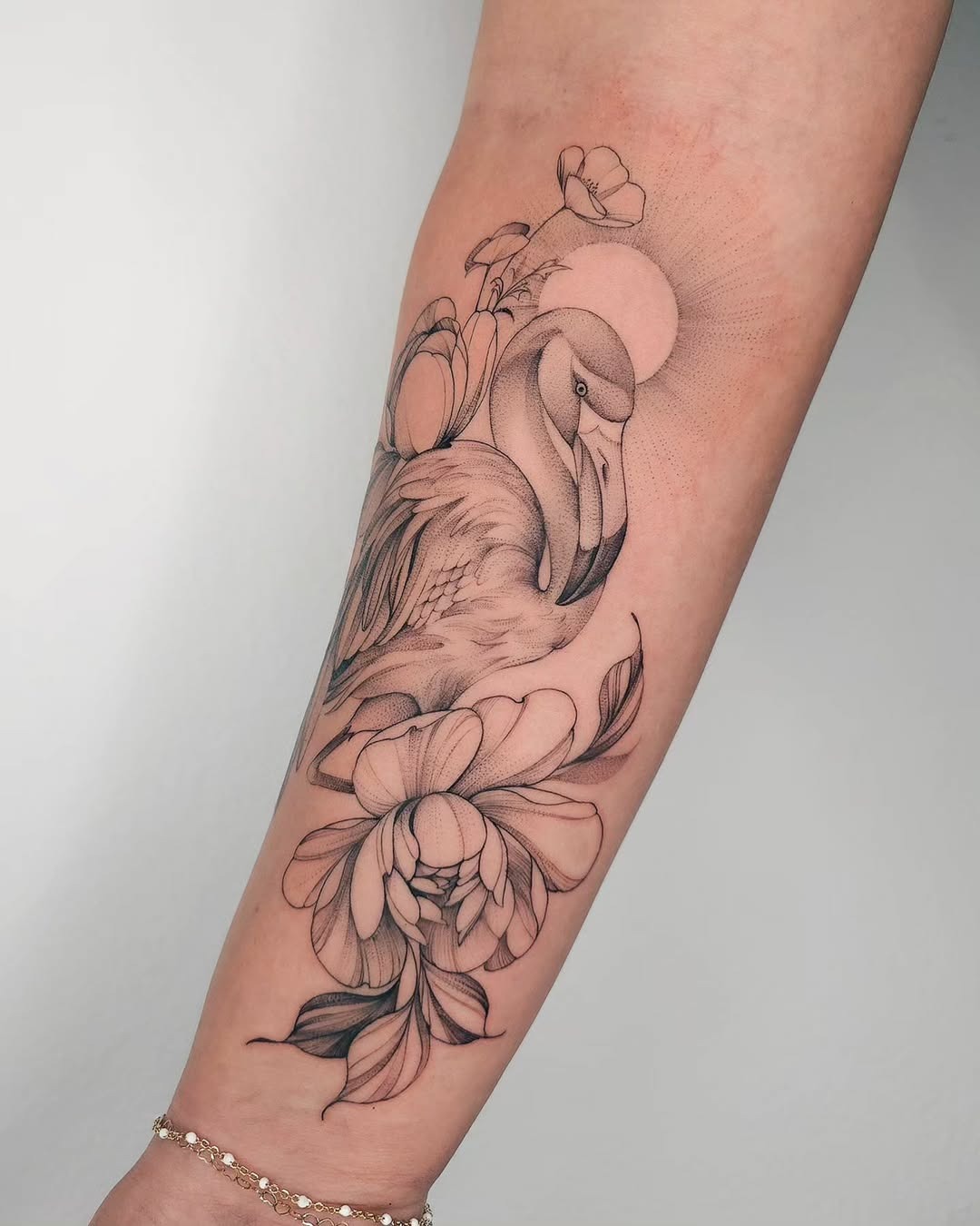 Elegant flamingo tattoo with floral accents Tattoo Design